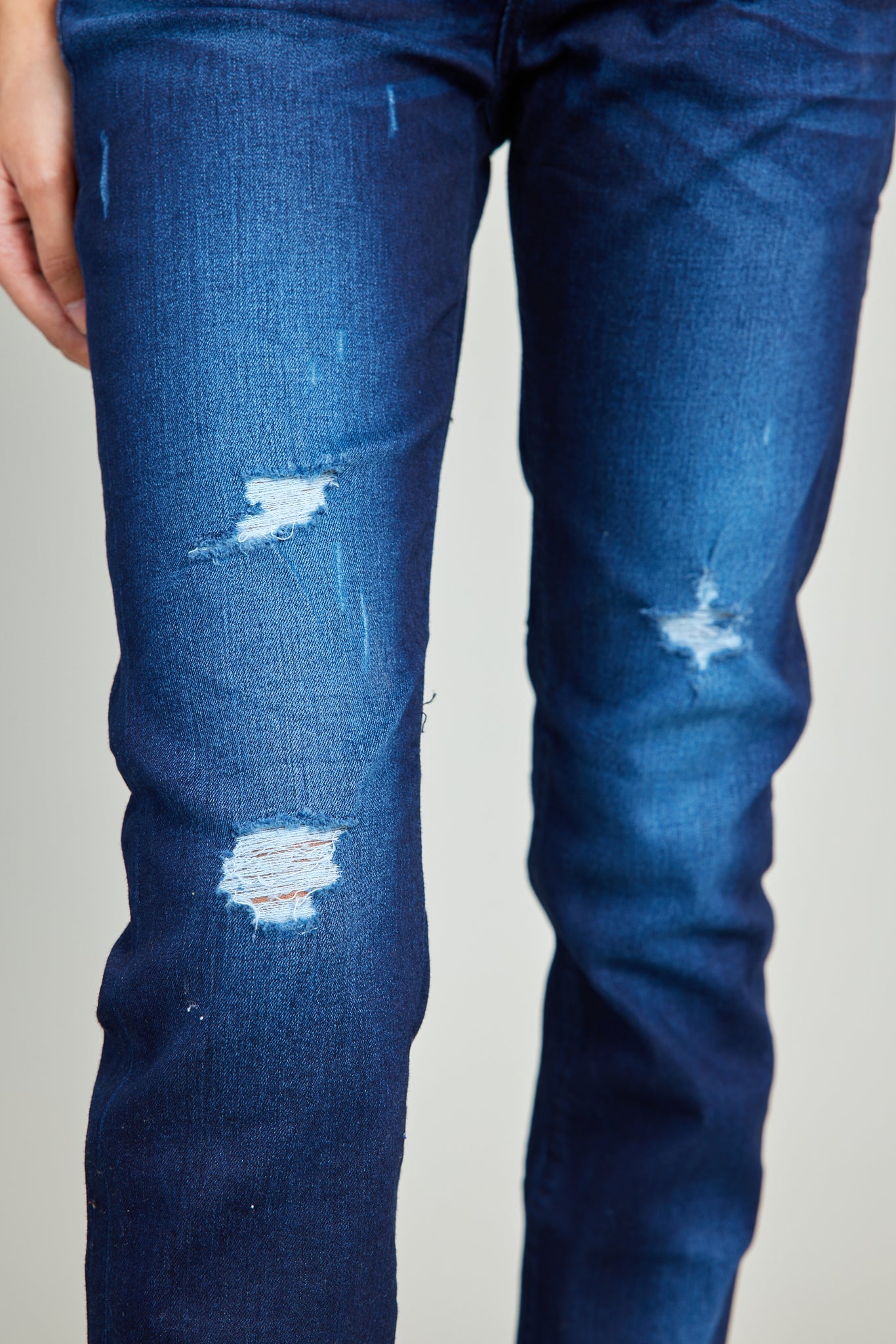 Heavily Destructed Dark Wash Blue Jeans